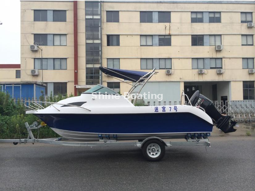 SHINE 550 Fiberglass Cabin Fishing Boat Exterior SHINE 550 5.5m Fiberglass Cabin Fishing Boat with Blue Hull and Bimini Top