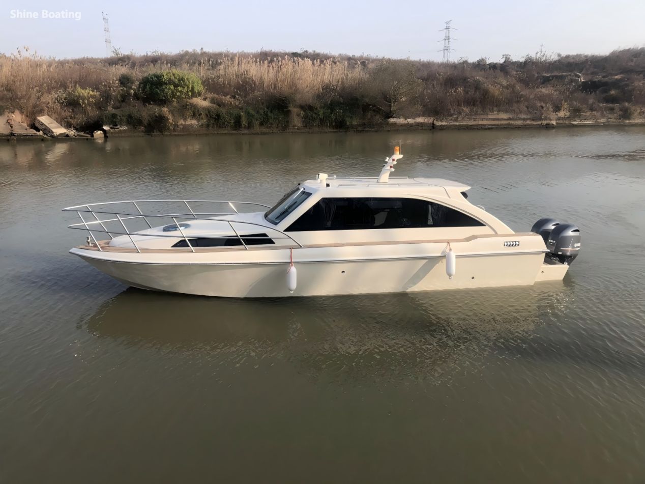 Shine 1008 Leisure Yacht on the Water Shine 1008 leisure yacht cruising on inland waters with twin outboard engines