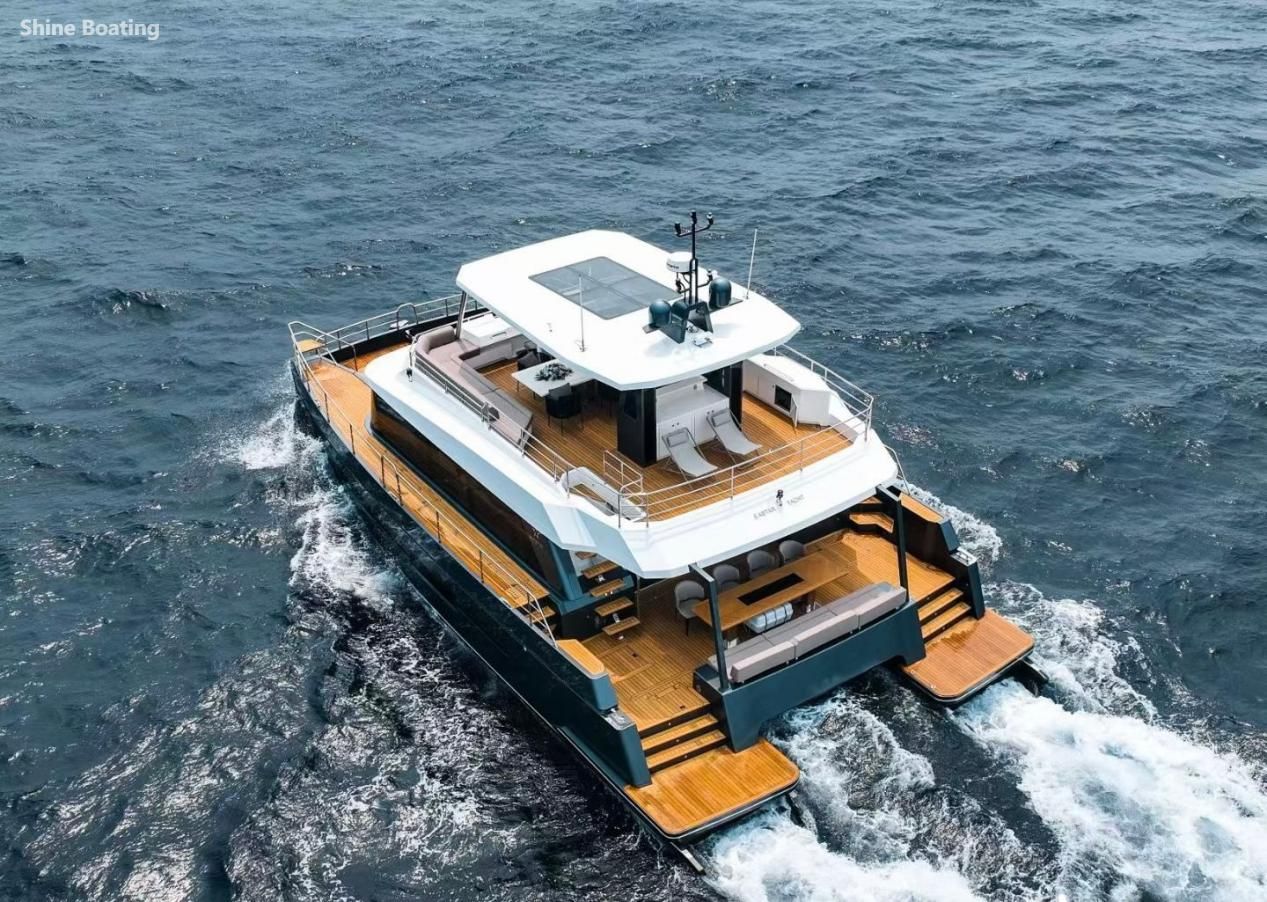 47ft Luxury Sailing Catamaran At‑Sea Cruising Aerial shot of 47ft luxury sailing catamaran with teak deck cruising on open sea